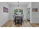 Bright dining area featuring modern table with seating for four and natural light from large window at 1253 Kenworth Circle, Conway, SC 29526