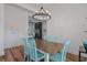 Bright dining room showcasing stylish light fixture and open to the cozy living area at 1253 Kenworth Circle, Conway, SC 29526
