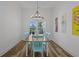 Bright dining room featuring wood flooring and a modern chandelier over the table at 1253 Kenworth Circle, Conway, SC 29526
