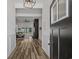 Inviting entryway featuring wood flooring, white wainscoting, and a glimpse into the open living space at 1253 Kenworth Circle, Conway, SC 29526