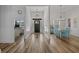 Bright entryway with wood floors leading to an office and dining area, enhancing the home's spacious feel at 1253 Kenworth Circle, Conway, SC 29526