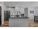 Modern kitchen featuring dark countertops, sleek black appliances, and bright white cabinetry at 1253 Kenworth Circle, Conway, SC 29526