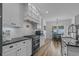 Beautifully designed kitchen with granite countertops, white cabinets, and stainless steel appliances at 1253 Kenworth Circle, Conway, SC 29526