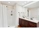 Well-lit bathroom with a double vanity, granite countertop, and stand-up shower at 126 Cleland St., Georgetown, SC 29440