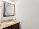 Bathroom vanity featuring granite countertop, wood cabinets and a large mirror at 126 Cleland St., Georgetown, SC 29440