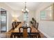Formal dining room with wooden table set for eight, chandelier, and hardwood floors at 126 Cleland St., Georgetown, SC 29440