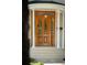 Close up of front door, with glass panels, supported by white columns at 126 Cleland St., Georgetown, SC 29440