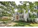 Charming two-story home with a brick facade, black shutters, and a well-manicured front lawn at 126 Cleland St., Georgetown, SC 29440
