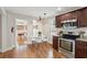 Compact kitchen with stainless appliances, and a white kitchen table with chairs at 126 Cleland St., Georgetown, SC 29440