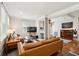 Cozy living room features hardwood floors, fireplace, comfortable seating, and neutral tones at 126 Cleland St., Georgetown, SC 29440