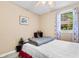 Bedroom with neutral walls, cozy blanket, and natural light streaming through the window at 1272 Park Hill Dr., Conway, SC 29526