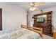 Cozy bedroom featuring a wooden bed frame and a TV built into the wooden dresser with drawers at 1272 Park Hill Dr., Conway, SC 29526