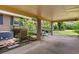 Carport attached to a brick home with an adjacent brick raised garden bed at 1272 Park Hill Dr., Conway, SC 29526