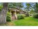 Attractive single-Gathering brick home with covered front porch, mature trees, and a lush lawn at 1272 Park Hill Dr., Conway, SC 29526