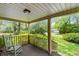 View from covered front porch with rocking chair overlooking lush front yard and quiet street at 1272 Park Hill Dr., Conway, SC 29526