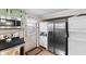 Well lit kitchen equipped with stainless appliances and a back door, offering convenience and style at 1272 Park Hill Dr., Conway, SC 29526