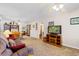 Comfortable living room with a cozy sofa, large TV, and ceiling fan that connects to the dining area at 1272 Park Hill Dr., Conway, SC 29526
