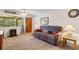 The living room has a comfortable sofa, a large window, and a view of the backyard at 1272 Park Hill Dr., Conway, SC 29526