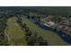 Beautiful aerial view of a home on a golf course with waterfront access and lush landscaping at 1503 Cadiz Dr., Myrtle Beach, SC 29579