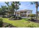 Well manicured back yard with a pool, mature trees and lush landscaping at 1503 Cadiz Dr., Myrtle Beach, SC 29579