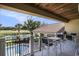 Relax on this cozy covered balcony overlooking a pool, golf course and waterfront views at 1503 Cadiz Dr., Myrtle Beach, SC 29579