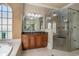 A remodeled bathroom is showcased by tile flooring, granite counter tops, and a glass enclosed shower at 1503 Cadiz Dr., Myrtle Beach, SC 29579