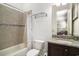 A standard bathroom includes a shower with tile surround, toilet, and granite top vanity at 1503 Cadiz Dr., Myrtle Beach, SC 29579