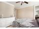 A bedroom features a dresser, neutral walls, and a bed with a decorative comforter at 1503 Cadiz Dr., Myrtle Beach, SC 29579
