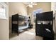 Bedroom featuring a bunk bed with a ceiling fan and neutral-colored walls, illuminated by natural light at 1503 Cadiz Dr., Myrtle Beach, SC 29579