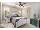 A comfortable bedroom features a large window for natural light and neutral decor at 1503 Cadiz Dr., Myrtle Beach, SC 29579