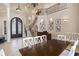 Elegant dining room with a staircase and bar in the background at 1503 Cadiz Dr., Myrtle Beach, SC 29579