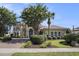 Stunning two-story home with a well-manicured lawn, mature trees, and a brick driveway at 1503 Cadiz Dr., Myrtle Beach, SC 29579