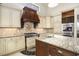 Gourmet kitchen with custom cabinetry, granite countertops, and a center island at 1503 Cadiz Dr., Myrtle Beach, SC 29579