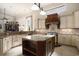 Spacious kitchen featuring a large island with granite countertops and stainless steel appliances at 1503 Cadiz Dr., Myrtle Beach, SC 29579
