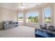 Living room with large windows overlooking the water and golf course views at 1503 Cadiz Dr., Myrtle Beach, SC 29579