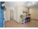 Welcoming foyer featuring tiled floors, a decorative table, and a glimpse into another room, creating a warm entry at 1546 Bay Tree Ln., Myrtle Beach, SC 29575
