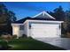 Charming one-story home featuring a two-car garage, welcoming entrance, and beautiful landscaped lawn at 1549 Regal Fern Way, Longs, SC 29568