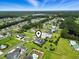 Aerial view of suburban community with manicured lawns, tree-lined streets, and nearby wooded areas at 157 Pottery Landing Dr., Conway, SC 29526