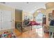 Bright bonus room with hardwood floors, vaulted ceilings, and decorative wrought iron stair railing at 157 Pottery Landing Dr., Conway, SC 29526