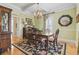 Traditional dining room features hardwood floors, elegant furnishings, and a decorative rug at 157 Pottery Landing Dr., Conway, SC 29526