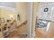 Welcoming foyer with decorative glass door, hardwood floors and staircase with creative wall decor at 157 Pottery Landing Dr., Conway, SC 29526