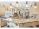 Gourmet kitchen features custom cabinets, granite countertops, and stainless steel appliances at 157 Pottery Landing Dr., Conway, SC 29526