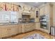 Well-appointed kitchen with custom cabinets, granite countertops, stainless steel appliances, and a decorative rug at 157 Pottery Landing Dr., Conway, SC 29526