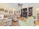 Spacious living room featuring a fireplace, built-in shelving, and comfortable seating at 157 Pottery Landing Dr., Conway, SC 29526