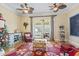 Cozy living room featuring hardwood floors, ceiling fans, and a doorway to the exterior at 157 Pottery Landing Dr., Conway, SC 29526