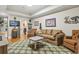 Cozy living room features natural light and comfortable seating for relaxation and conversation at 157 Pottery Landing Dr., Conway, SC 29526