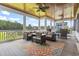 Relaxing screened porch with comfortable seating, ceiling fans, a nice view, and outdoor furniture at 157 Pottery Landing Dr., Conway, SC 29526