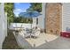 Outdoor patio featuring tile floors, dining set, lounge chairs, and shade umbrella at 1575 Victoria Ln., Myrtle Beach, SC 29577