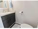 This half bath features a sleek vanity with a modern sink and ample counter space at 1575 Victoria Ln., Myrtle Beach, SC 29577