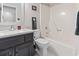 Nicely designed full bathroom showcasing a bath with shower, modern fixtures, and a toilet at 1575 Victoria Ln., Myrtle Beach, SC 29577